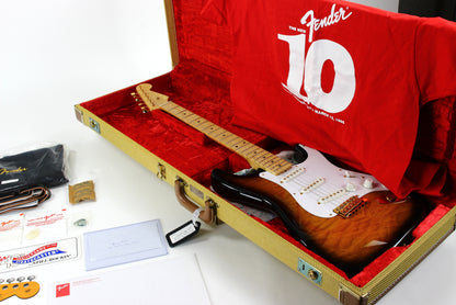 Fender Bill Carson guitar in a red case with accessories on a white background