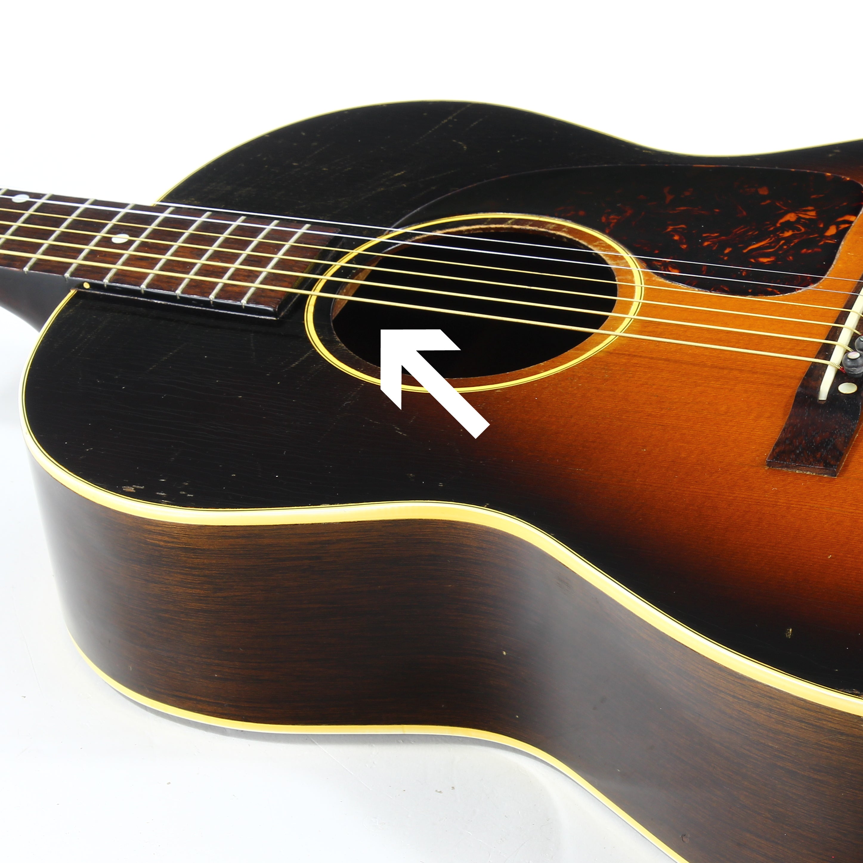 1940's Gibson LG-2 with arrow pointing to neck block