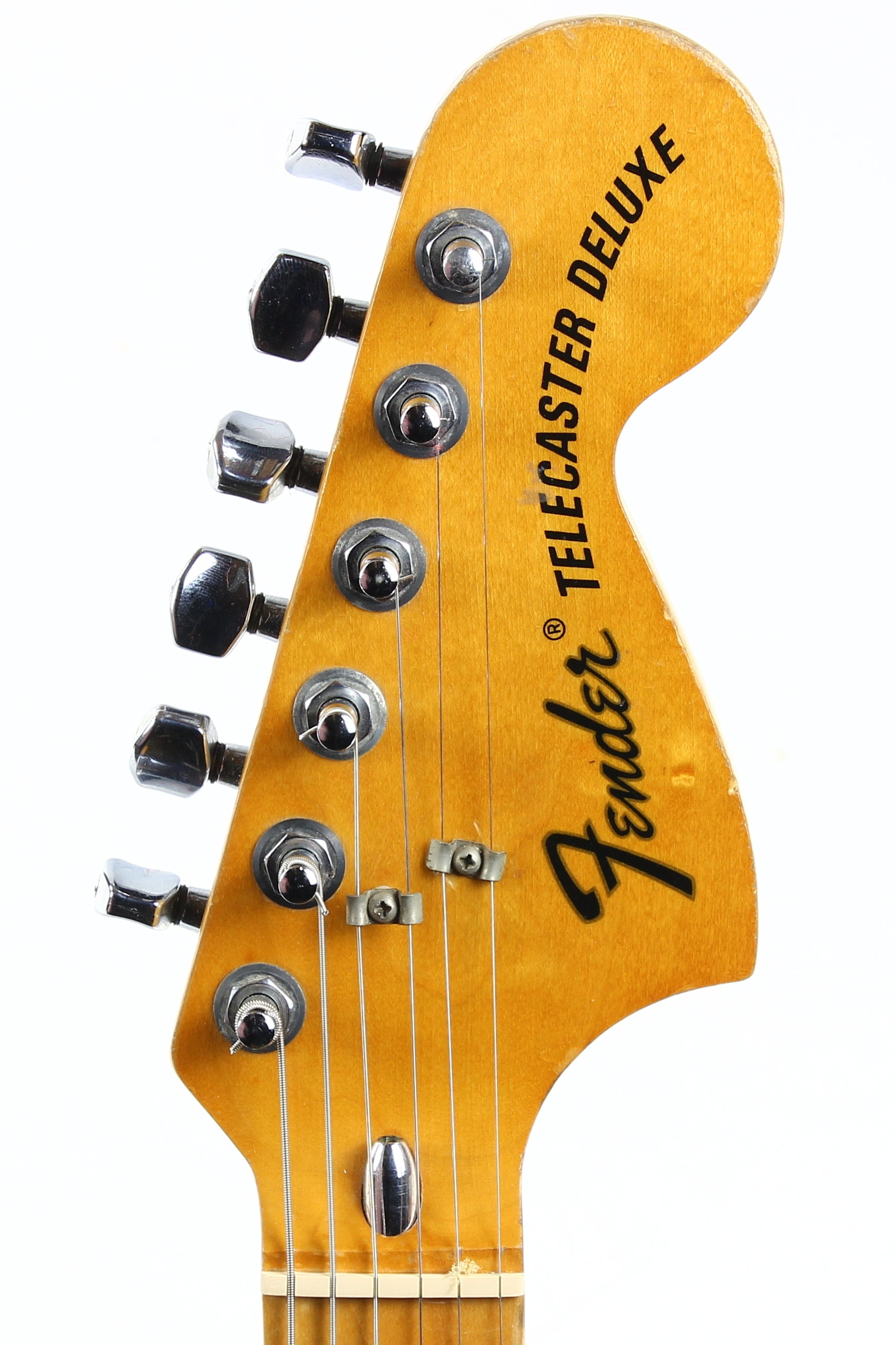 Fender Telecaster Deluxe guitar headstock with brand name on a white background
