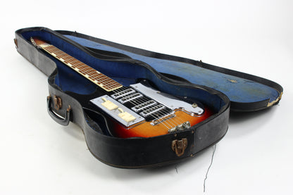 Guitar in a black case on a white background