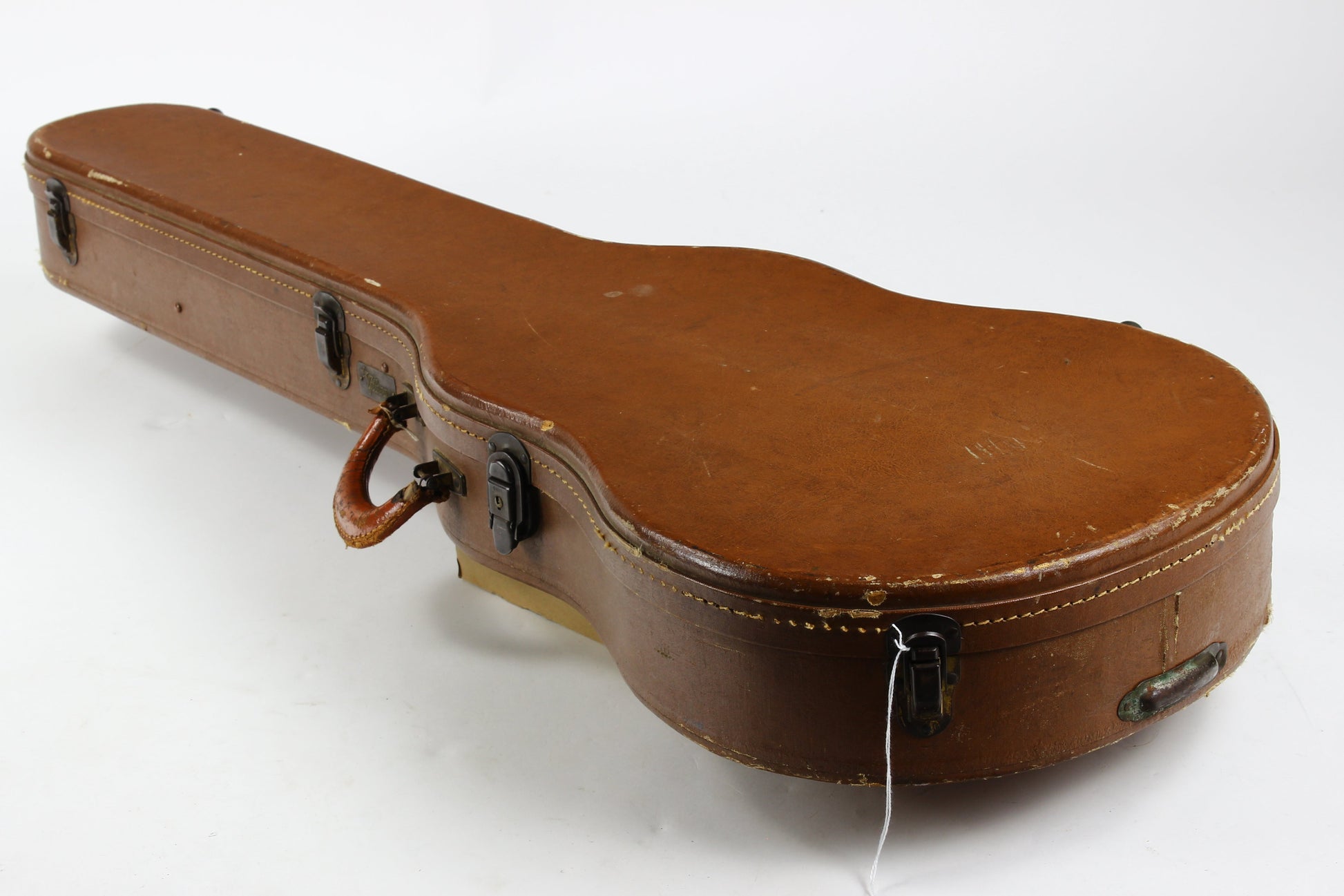 Brown Lifton Gibson guitar case on a white background