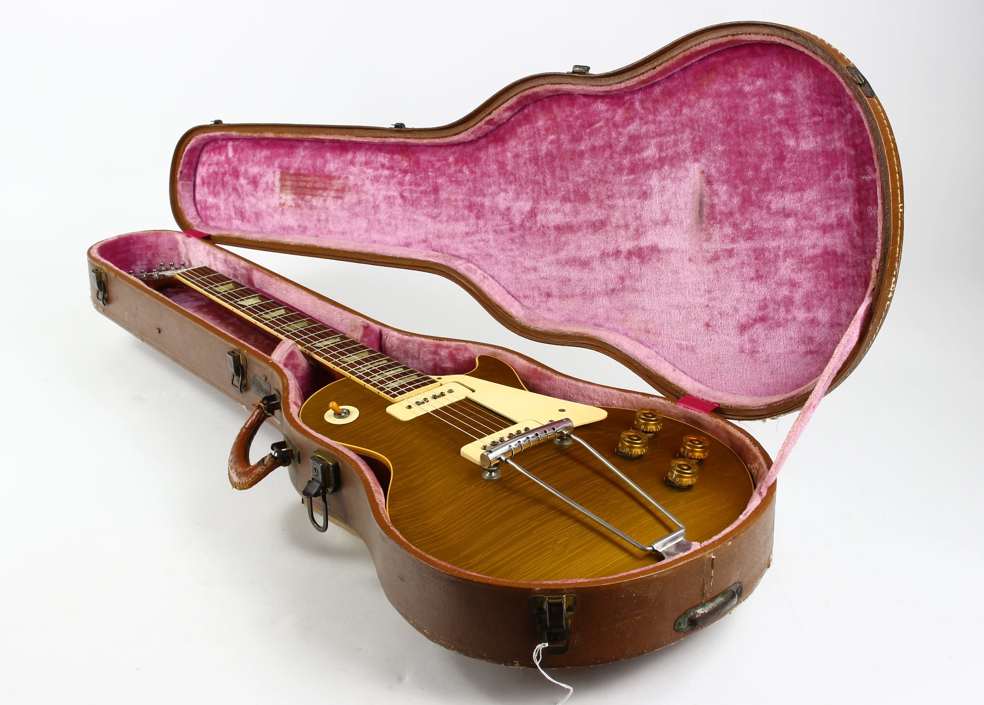 1953 Gibson Les Paul Guitar in a pink-lined case on a white background